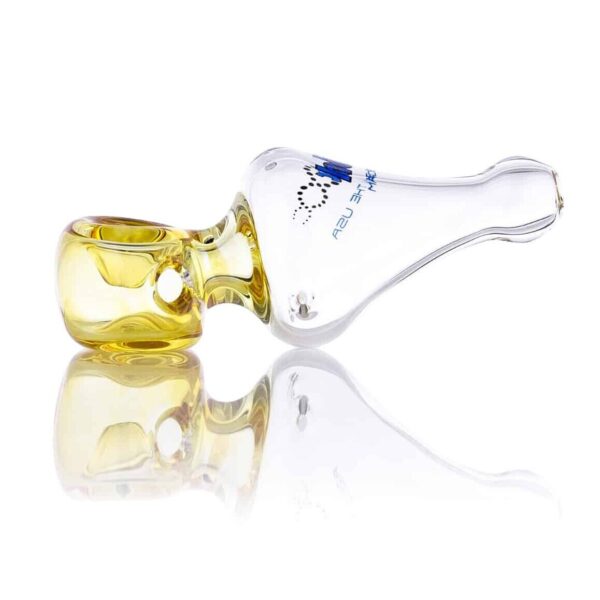 A glass pipe sitting on top of a table.