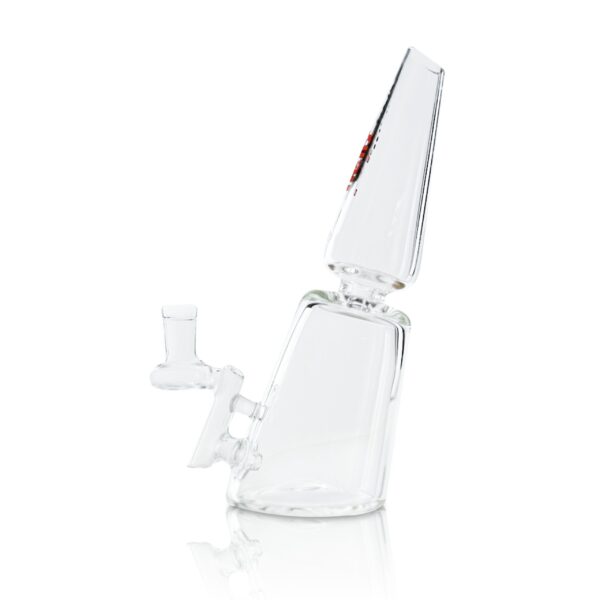 A clear glass pipe sitting on top of a white table.